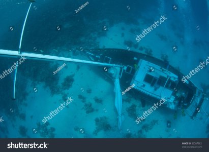 stock-photo-underwater-sunken-sail-boat-ship-wreck-59787802.jpg