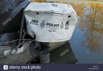an-outboard-motor-cover-on-a-police-broads-beat-boat-on-the-norfolk-broads-at-barton-turf-norfol.jpg